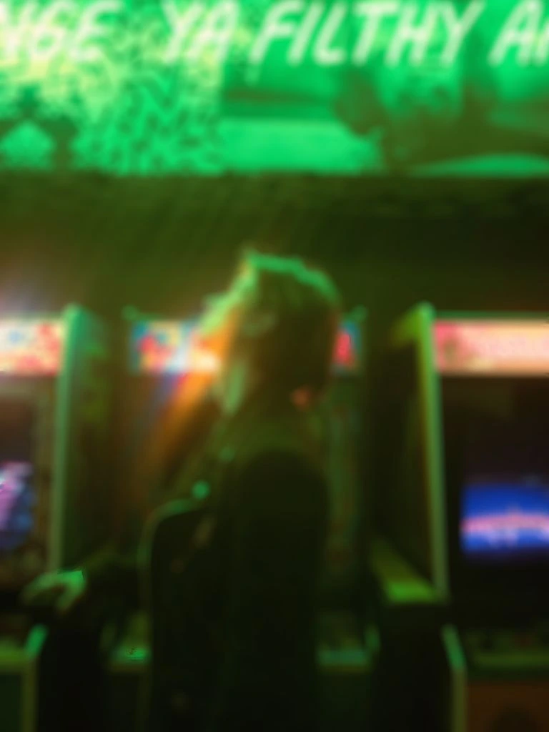 Neon racing track in-game still used for a video game soundtrack placement